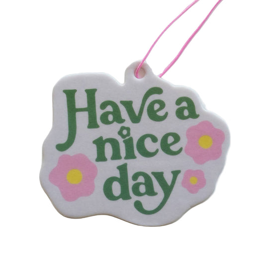 Decorative tag with 'Have a nice day' text and floral designs on a white background